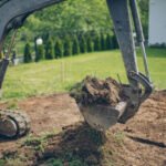 Working Excavator Digging A Trench At Construction Site