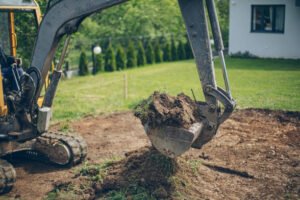 Working Excavator Digging A Trench At Construction Site