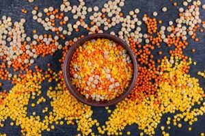Assorted pulses in bowls showing different varieties of dal