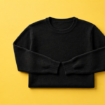 Black Sweater on Yellow Background