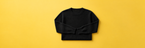 Black Sweater on Yellow Background