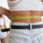 How does Tummy Tuck support a smoother abdominal appearance