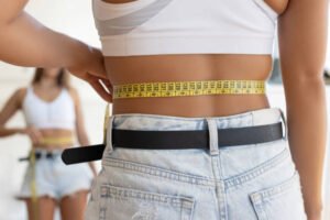 How does Tummy Tuck support a smoother abdominal appearance