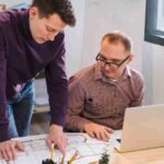 adult-men-working-together-project_11zon
