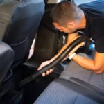 Man washes his car on a self service carwash