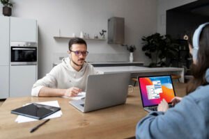 man-woman-working-from-home-together-desk